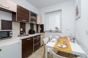 Apartment | Private kitchen | Fridge, microwave, stovetop, dishwasher