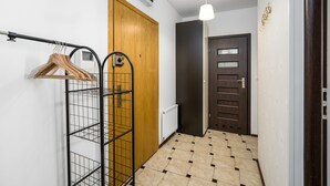 Apartment | Living area | 32-inch flat-screen TV with cable channels, TV - Sleepway Apartments - Garbary 95-101d (Poznan)