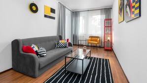 Apartment | Living area | 32-inch flat-screen TV with cable channels, TV - Sleepway Apartments - Garbary 95-101d (Poznan)