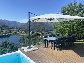 Enjoy dining or relaxing on the deck with a view of the lake and surrounding mountains.