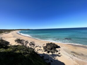 On the beach, sun-loungers