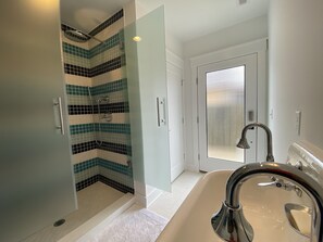 Bathtub, hair dryer, towels, soap