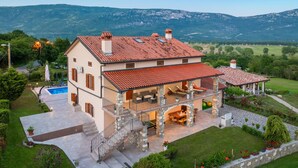 A two-story house with a swimming pool, stone staircase, and a view of mountains. - Awesome home in Krsan with private swimming pool, can be inside or outside (Krsan)
