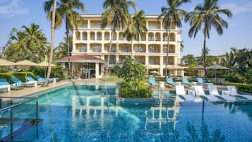 Outdoor pool, open 8:00 AM to 8:00 PM, pool umbrellas