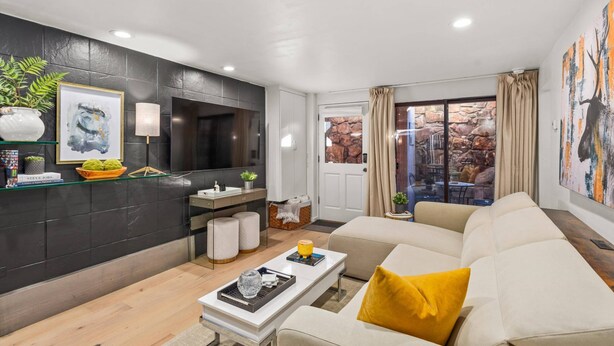 A modern living room with a sofa, coffee table, and artwork on the walls. - Special VRBO Rates! - Steps to Gondola! Cozy Aspen Stay (Aspen)