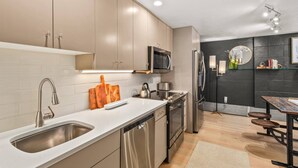 A modern kitchen with stainless steel appliances, a dishwasher, and a microwave. - Special VRBO Rates! - Steps to Gondola! Cozy Aspen Stay (Aspen)