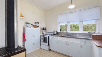 Fridge, microwave, toaster, cookware/dishes/utensils