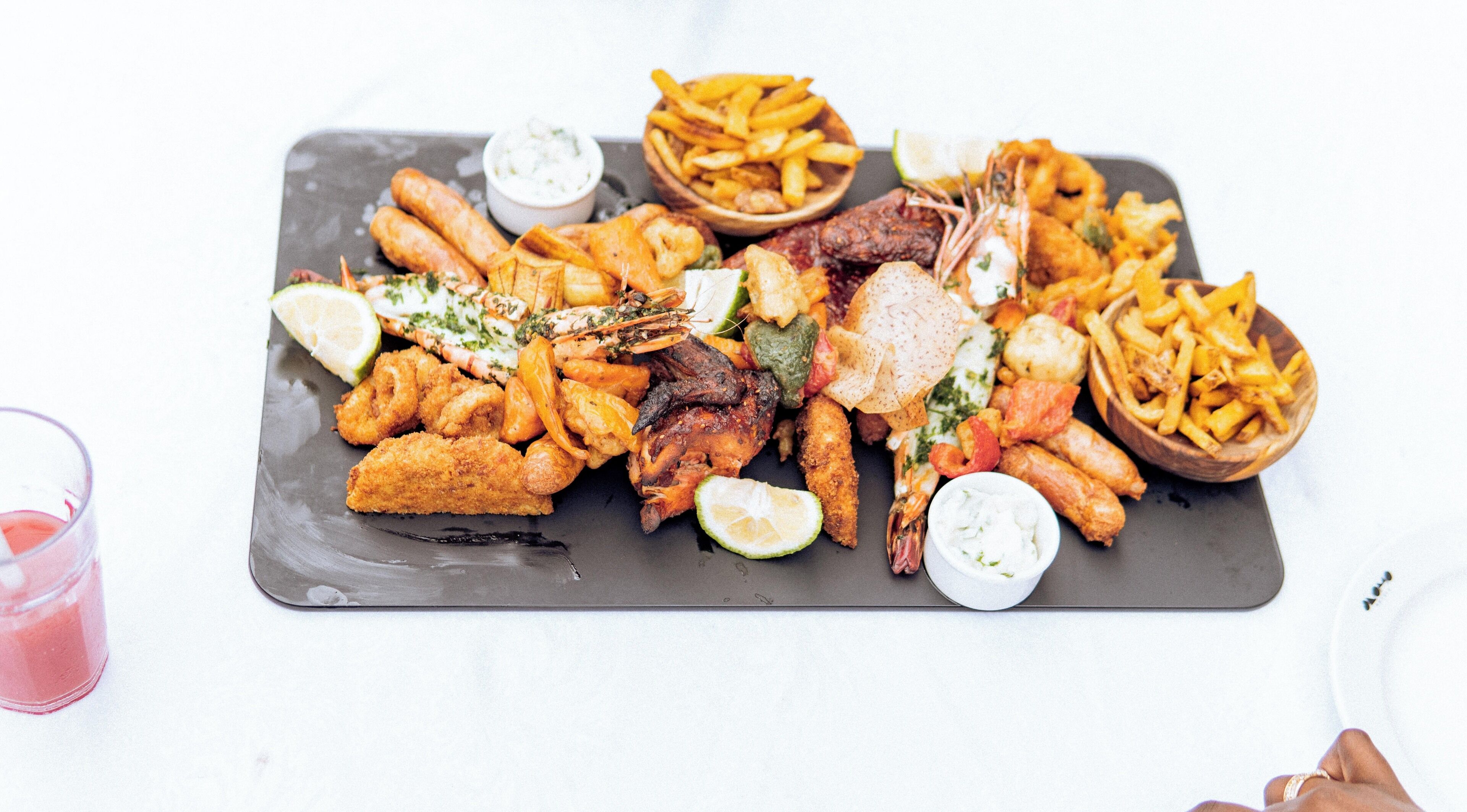 A variety of fried seafood and chips on a tray.