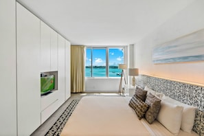 Premium Studio Suite, 1 King Bed, Balcony, Bay View | Living area | 55-inch flat-screen TV with cable channels, TV