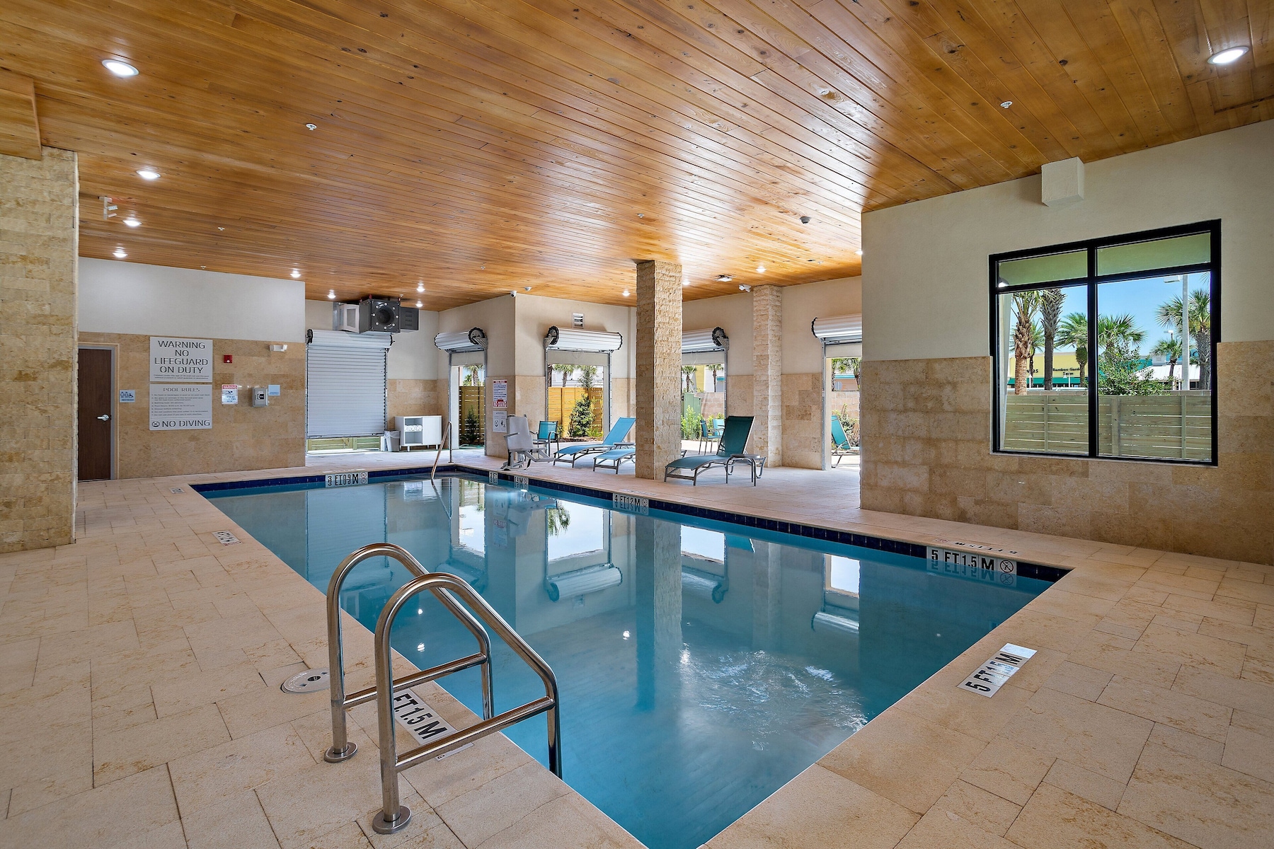 Indoor pool, open 9:00 AM to 10:00 PM, pool umbrellas, sun loungers
