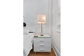 Bedside table with modern lamp
