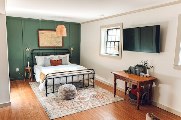 Queen sized bed with television