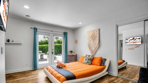 A modern hotel room with a large bed, a desk, and a view of the outdoors. - EXCLUSIVE *PRIVATE* COMPOUND~ The Three Ten Hotel (Palm Springs)