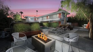 An outdoor patio with a fire pit, lounge chairs, and a pool area. - EXCLUSIVE *PRIVATE* COMPOUND~ The Three Ten Hotel (Palm Springs)