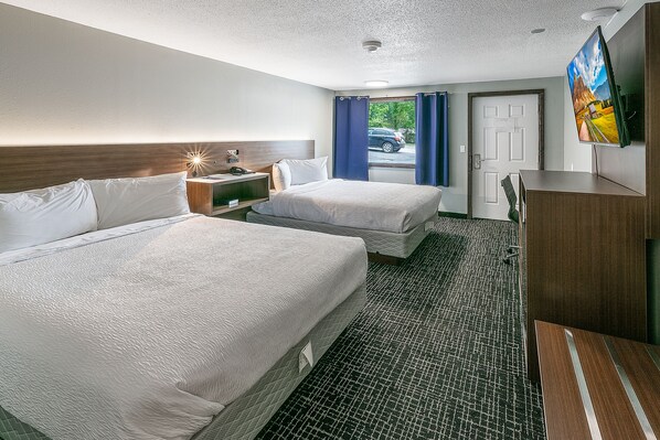 Tabla de planchar con plancha, wifi gratis y ropa de cama