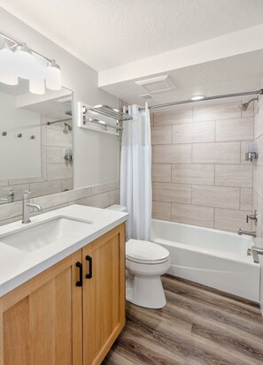 Combined shower/tub, hair dryer, towels, soap