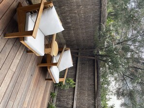 Relax on the deck with comfortable seating and a scenic view.