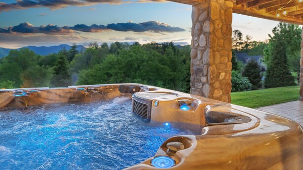 A hot tub with a stone pillar and a view of mountains and trees. - 6BR/4.5BR Retreat: Views, Pool, HotTub, Sauna & Game-room (Leicester)