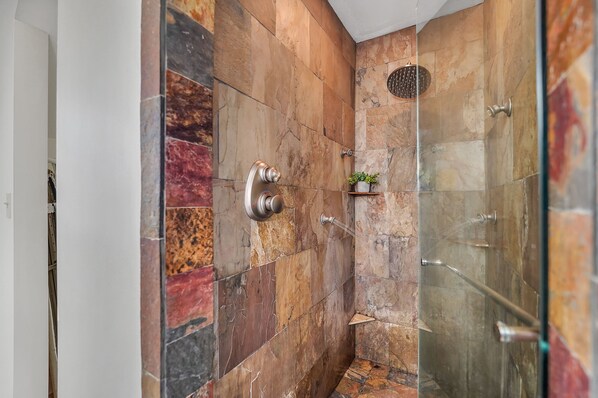 A shower with a glass door, a potted plant, and a handrail. - 6BR/4.5BR Retreat: Views, Pool, HotTub, Sauna & Game-room (Leicester)