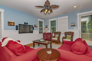 Flat-screen TV, DVD player, books