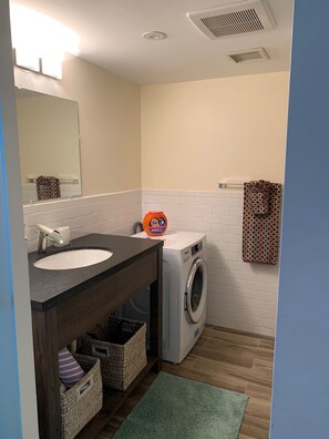 Shower, hair dryer, towels, soap