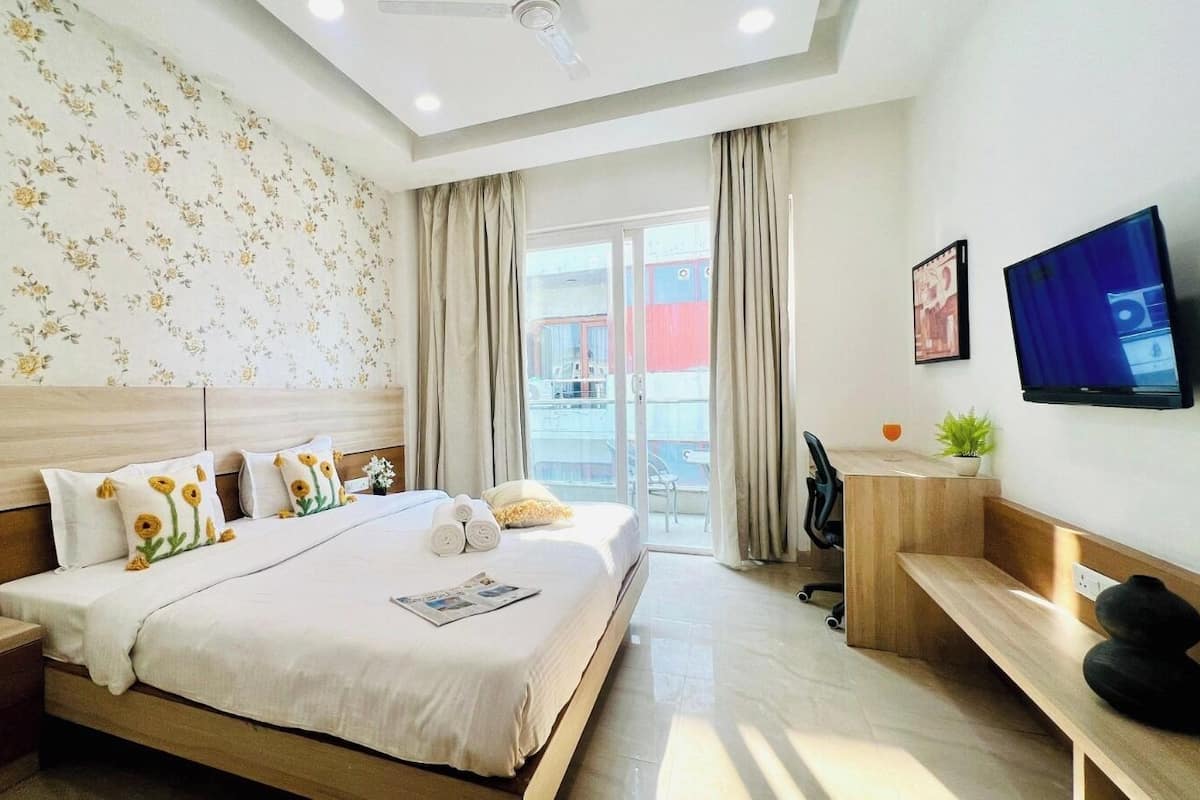 1 quarto, roupas de cama premium, espaço de trabalho para notebook