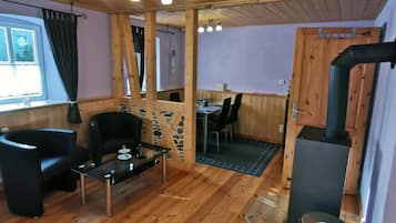 Apartment | Living room | 30-inch flat-screen TV with satellite channels, TV, DVD player