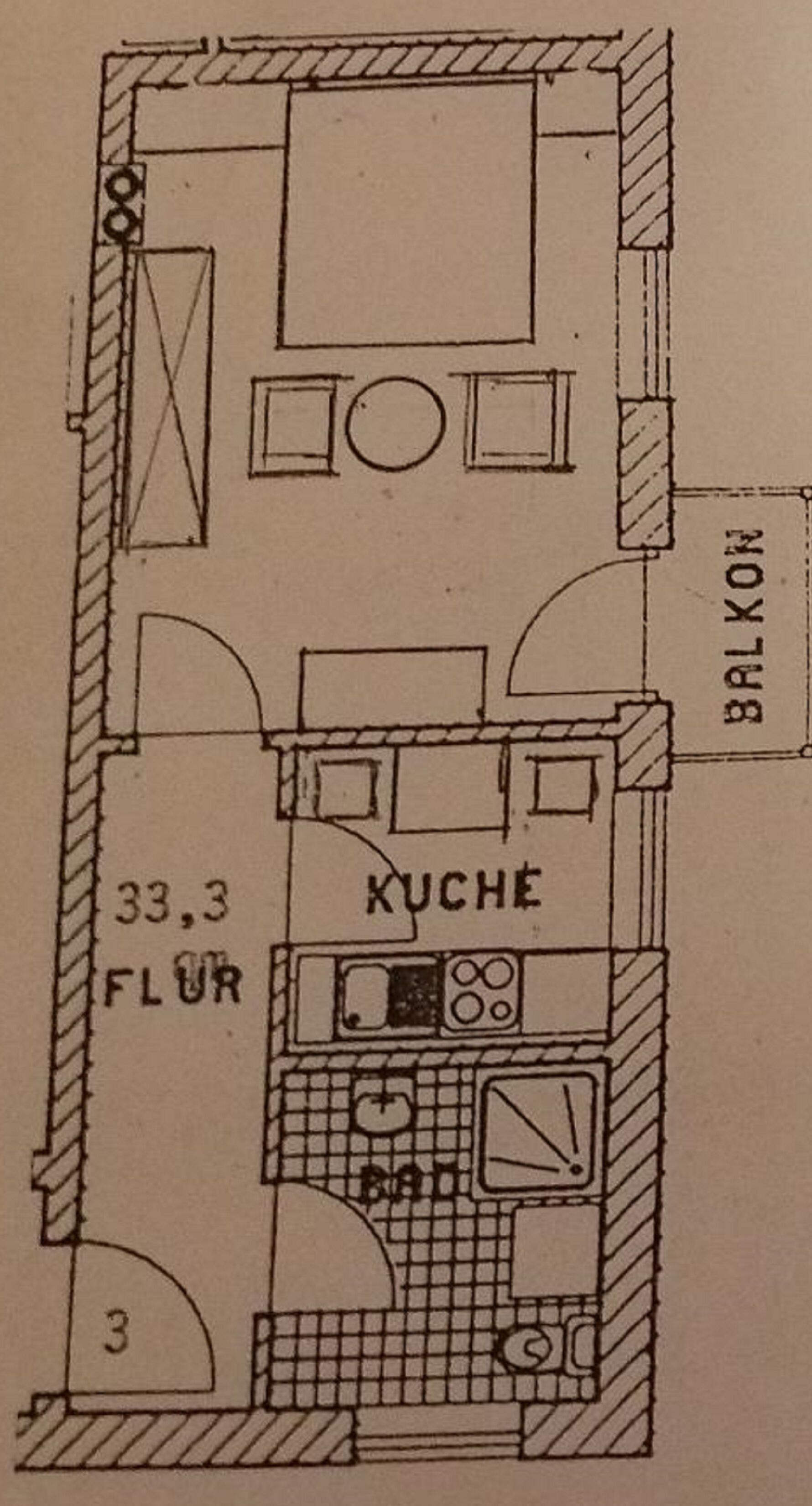 Plano de planta que muestra una cocina, una cocina americana y un balcón.