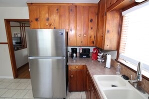Fridge, microwave, stovetop, dishwasher - Tulsa home conveniently by Brookside and Riverside with large fenced backyard (Tulsa)