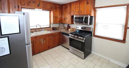 Tulsa home conveniently by Brookside and Riverside with large fenced backyard