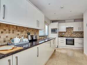 Astianpesukone, syöttötuoli