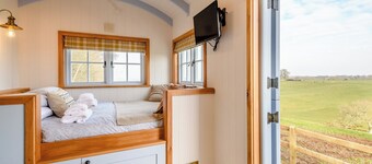 A perfectly formed shepherds hut that has been styled and furnished with flair.