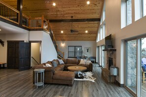 Flat-screen TV, fireplace, smart speakers