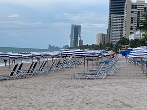 On the beach, sun-loungers, beach towels