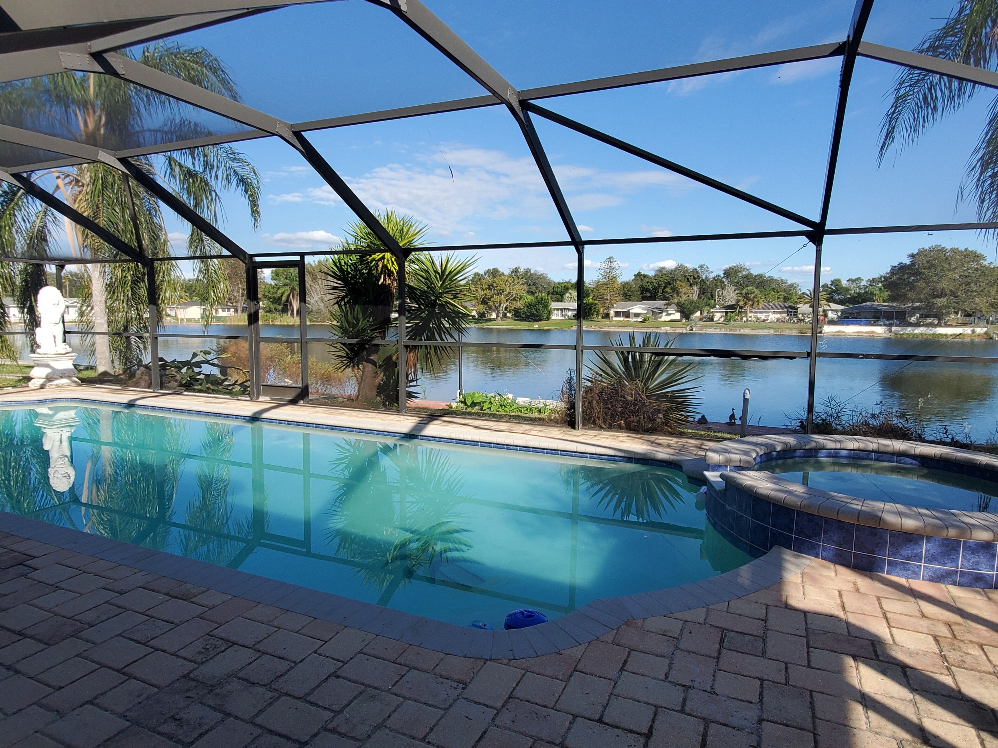 Tropical Waterfront HEATED Pool/SPA Home by  9 BEACHES & 9 STATE PARKS SLEEPS 11