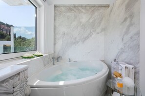 Bathtub, hair dryer, towels