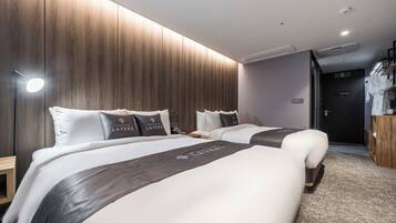 Deluxe Quadruple Room, 2 Double Beds | Down comforters, memory foam beds, in-room safe, individually decorated