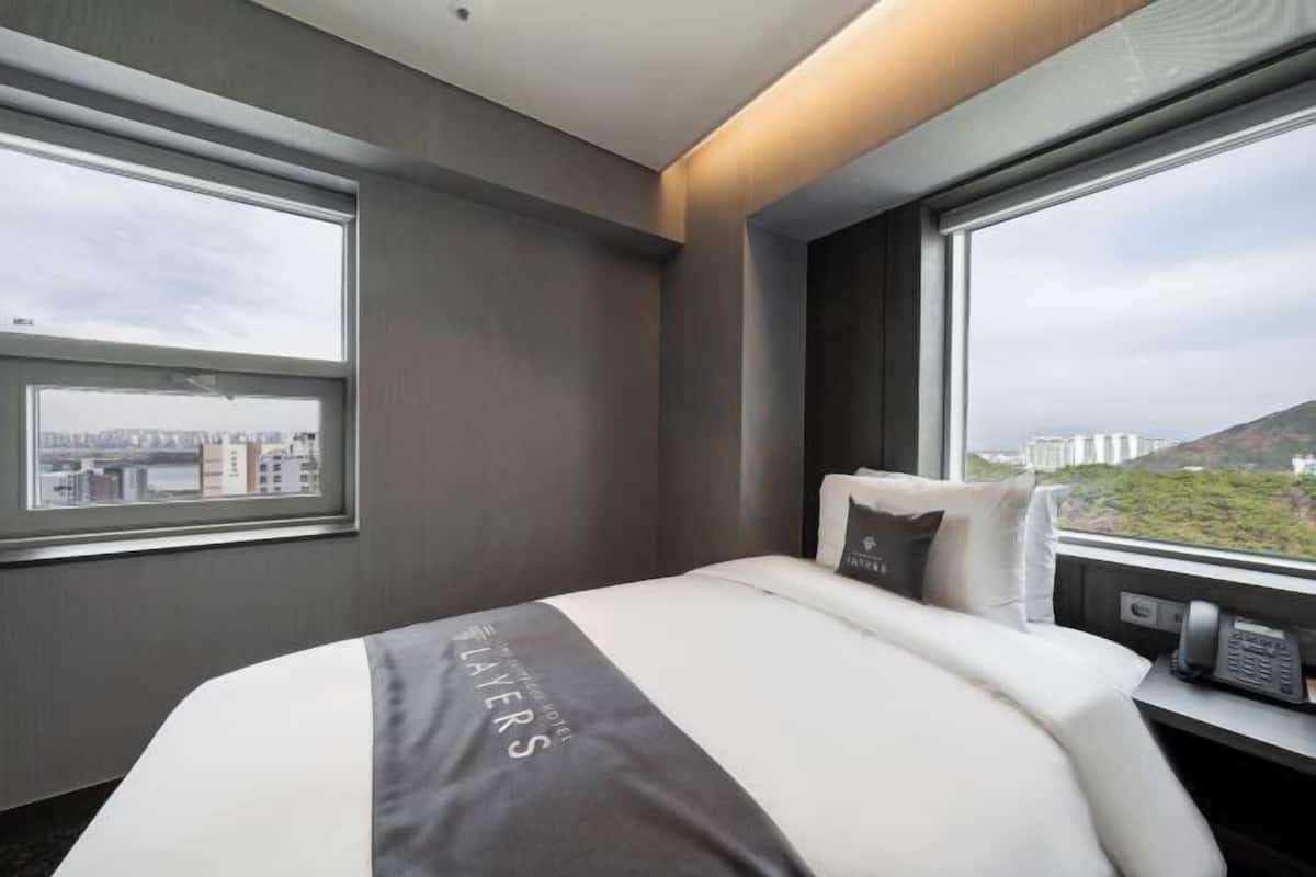 Down comforters, memory foam beds, in-room safe, blackout drapes