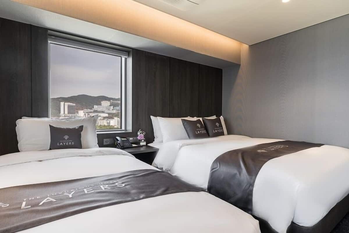 Superior Twin Room | Down comforters, memory foam beds, in-room safe, individually decorated