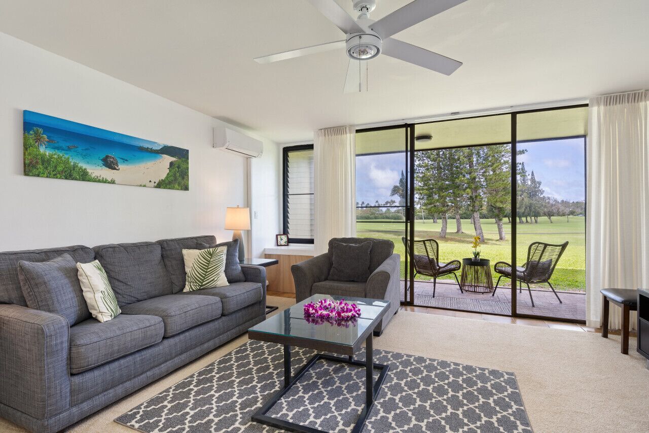 Bright living area opening to greenery for relaxed lounging