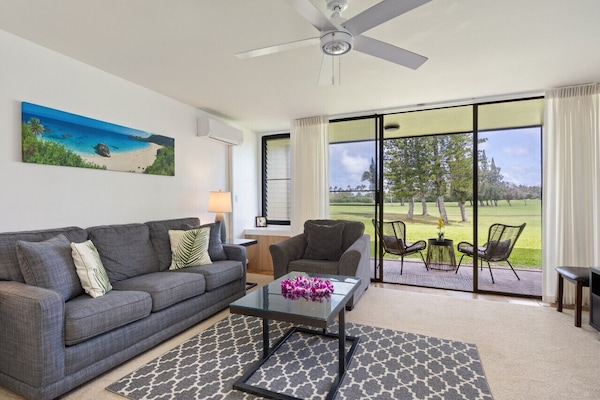 Bright living area opening to greenery for relaxed lounging