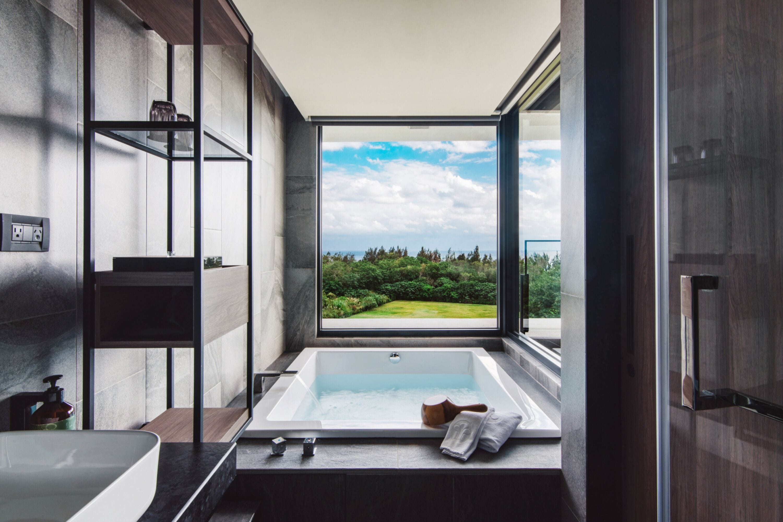 building tranquil - executive deluxe junior suite with ocean view | bathroom | separate bathtub and shower, rainfall showerhead, hair dryer, slippers