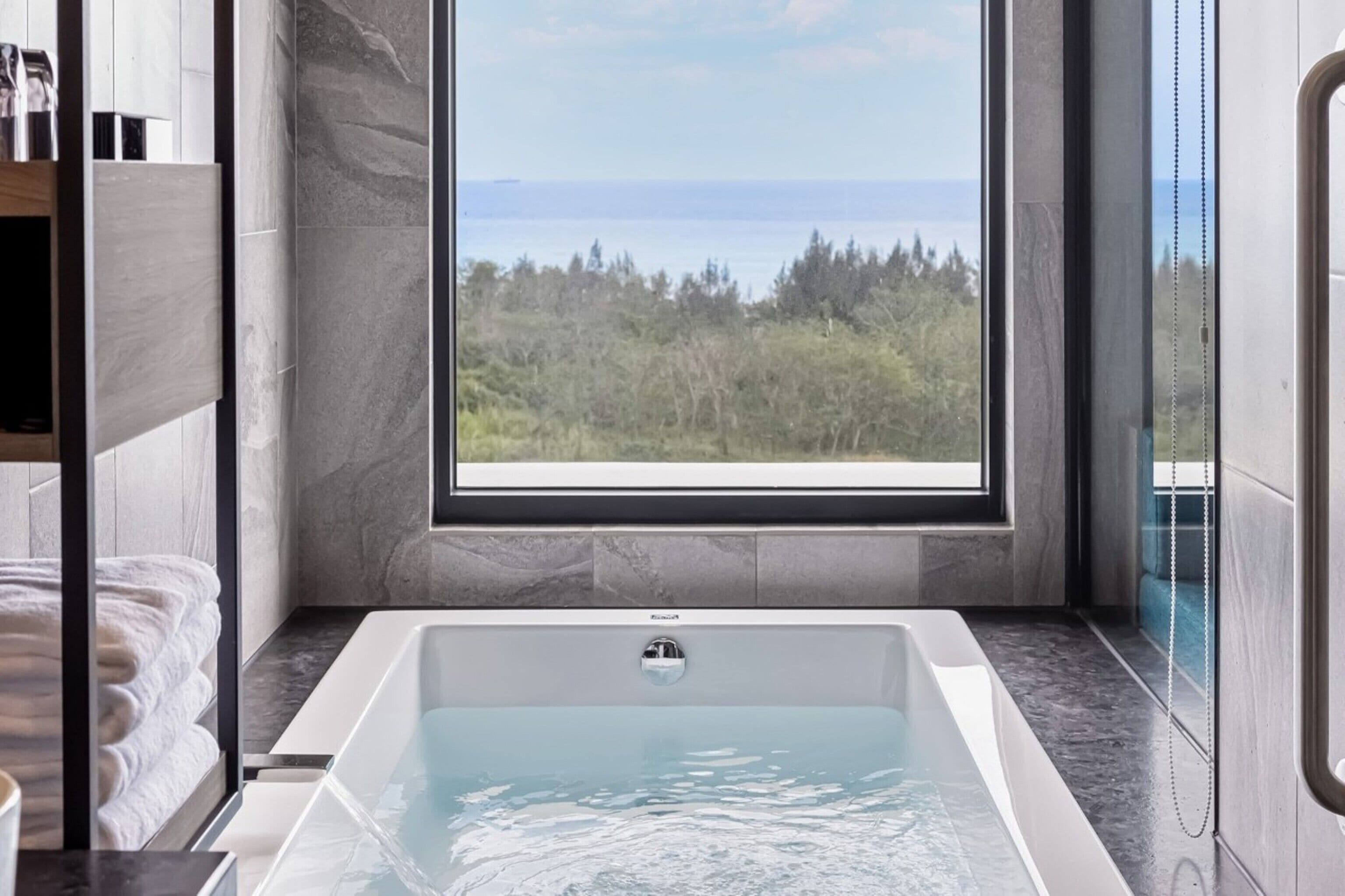 separate bathtub and shower, rainfall showerhead, hair dryer, slippers