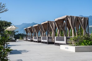 Outdoor pool, open 7:00 AM to 10:00 PM, pool umbrellas, pool loungers