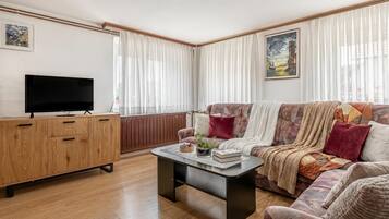 Family House, Multiple Bedrooms (Mržek House with Sauna) | Living area | 21-inch flat-screen TV with digital channels, TV, fireplace