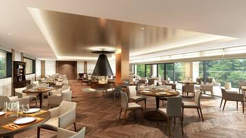 A spacious dining area with multiple round tables, chairs, and a central fire feature.