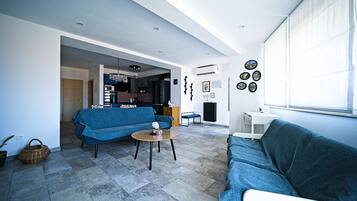 Apartment (A1) | Living area | 80-cm flat-screen TV with digital channels, TV