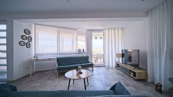 Apartment (A1) | Living area | 80-cm flat-screen TV with digital channels, TV