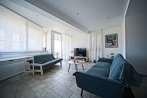 Apartment (A1) | Living area | 80-cm flat-screen TV with digital channels, TV