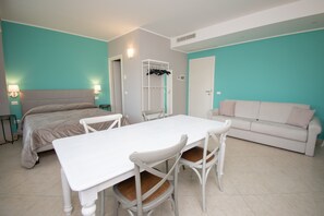 Studio (Fiordaliso) | Living area | 50-inch TV with cable channels - Luxury Martina Appartamenti (Moniga del Garda)